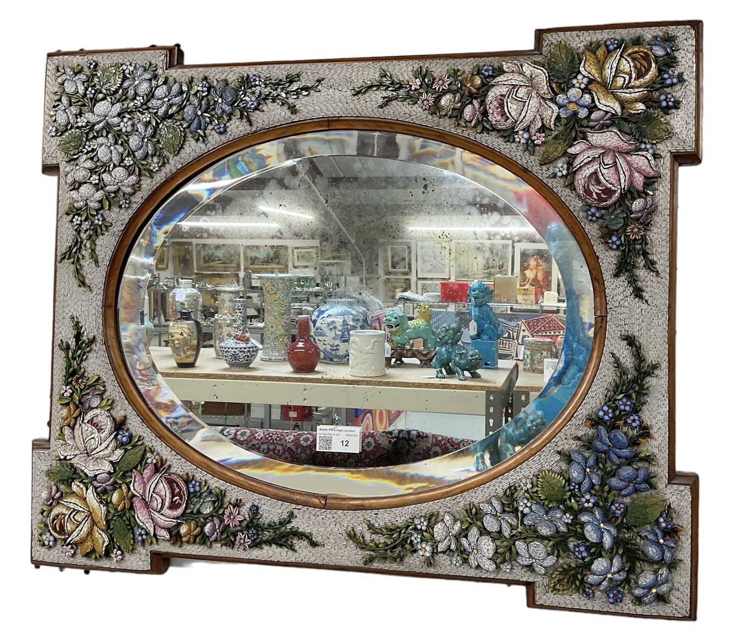 A micromosaic floral decorated bevelled glass wall mirror, 59 x 48cm.