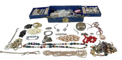 A large quantity of costume jewellery including bangles, rings, brooches, bracelets, beads, etc.