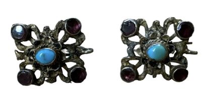A pair of ornate sterling silver turquoise and amethyst earrings.