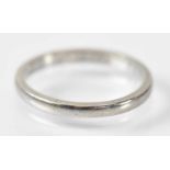 A platinum wedding band, marked 'Plat 0295' to the inside, size I, approx 2.5g.