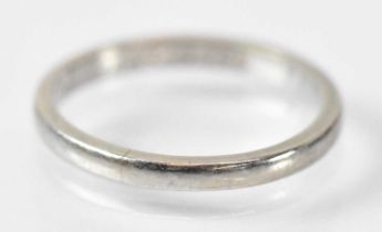 A platinum wedding band, marked 'Plat 0295' to the inside, size I, approx 2.5g.
