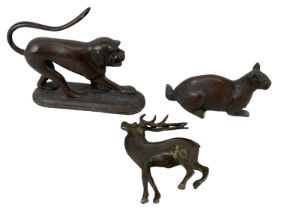 A group of three bronze models of animals including a monkey, a cat and a deer (3).