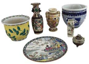 A group of seven pieces of Oriental ceramics including a modern Chinese charger decorated with