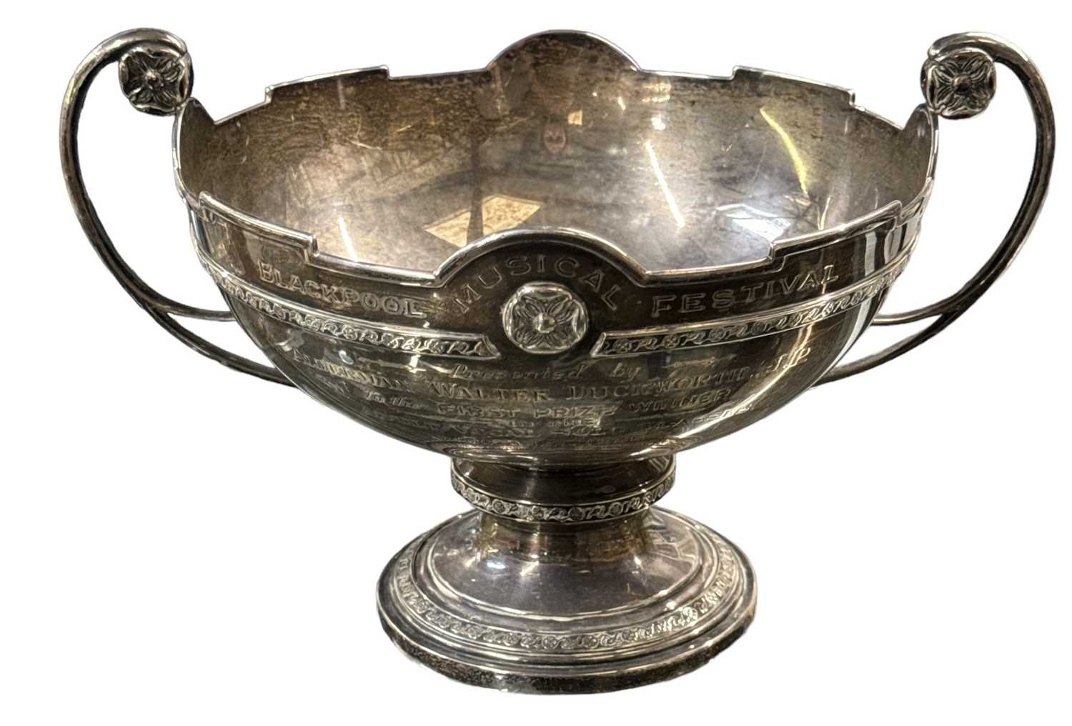 WILMOT MANUFACTURING CO; a George VI hallmarked silver twin handled footed bowl, presented as a