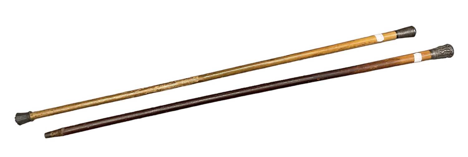 A white metal mounted cane with ribbed decoration to the top, length 91cm, and an Indian style white