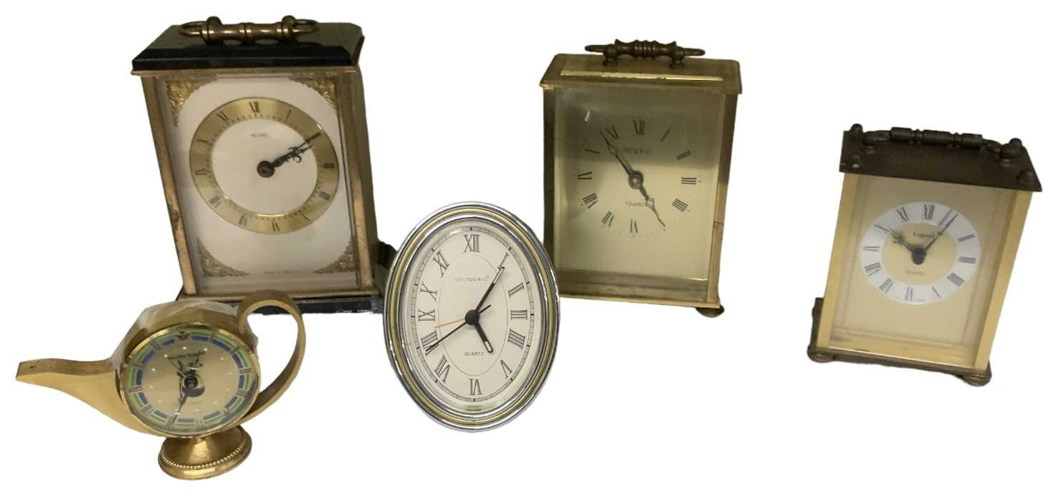 A group of five modern timepieces including President carriage clock, Metamec carriage clock,