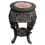 A 19th century Chinese hardwood marble topped jardinière stand, diameter of top 28cm, height 46cm.