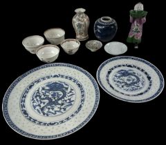 A 20th century Chinese blue and white plate decorated with a dragon, diameter 27cm, and a matching