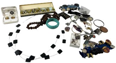 A quantity of costume jewellery including necklaces, beads, bangles, cufflinks, earrings, bracelets,