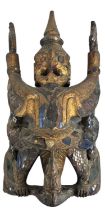 A Burmese carved hardwood gilt decorated figure of a Garuda bird, set with small jewels, height