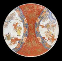 A late 18th century Japanese charger decorated in the Imari palette, with figures playing music
