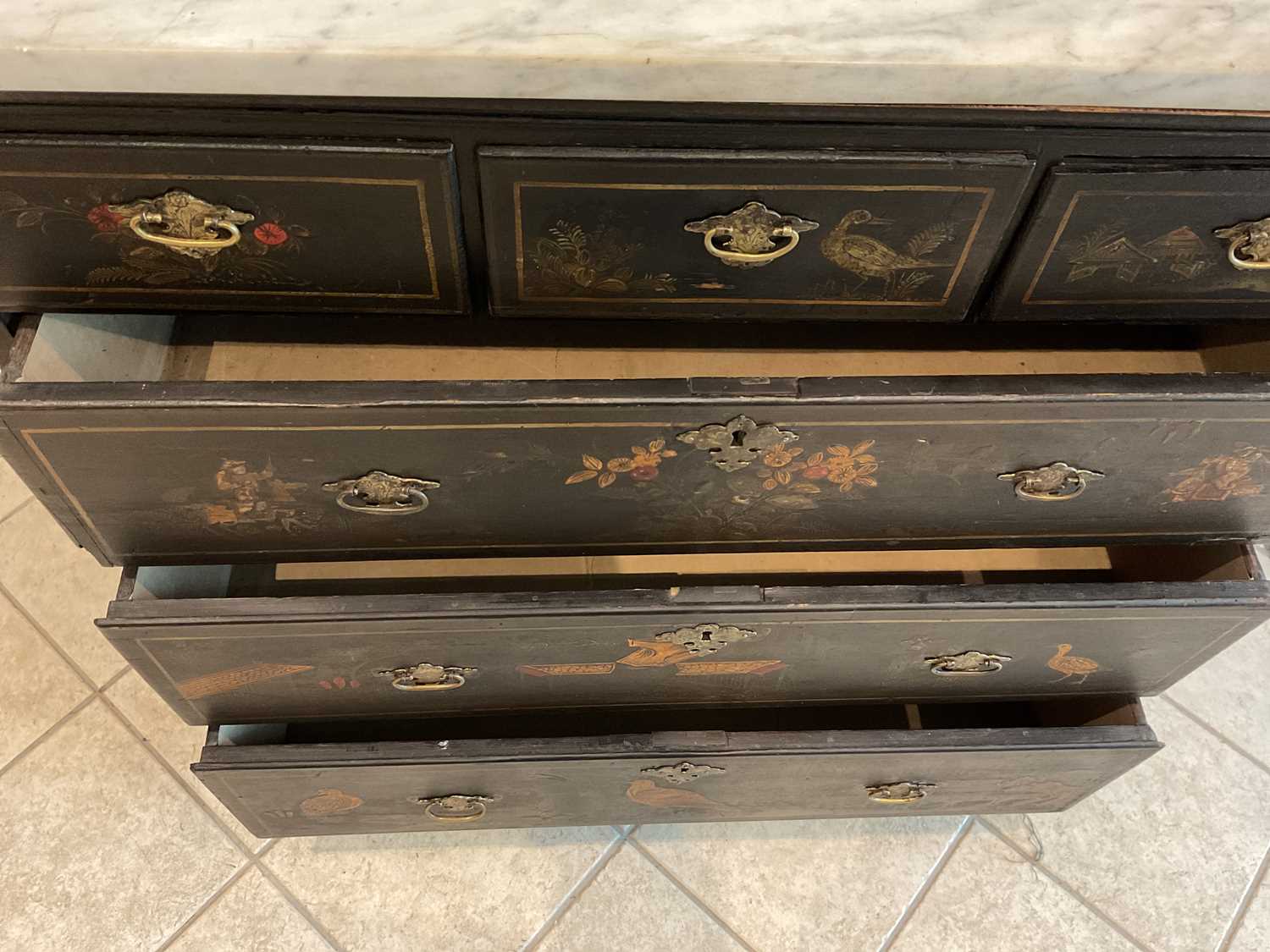 An 18th century black lacquered Chinoiserie decorated chest of three short over three long - Image 3 of 3