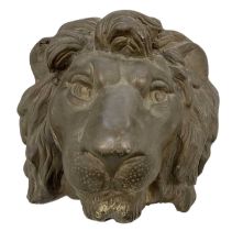 A bronze wall mounted figure of a lion's head, width 15cm, height 16cm.