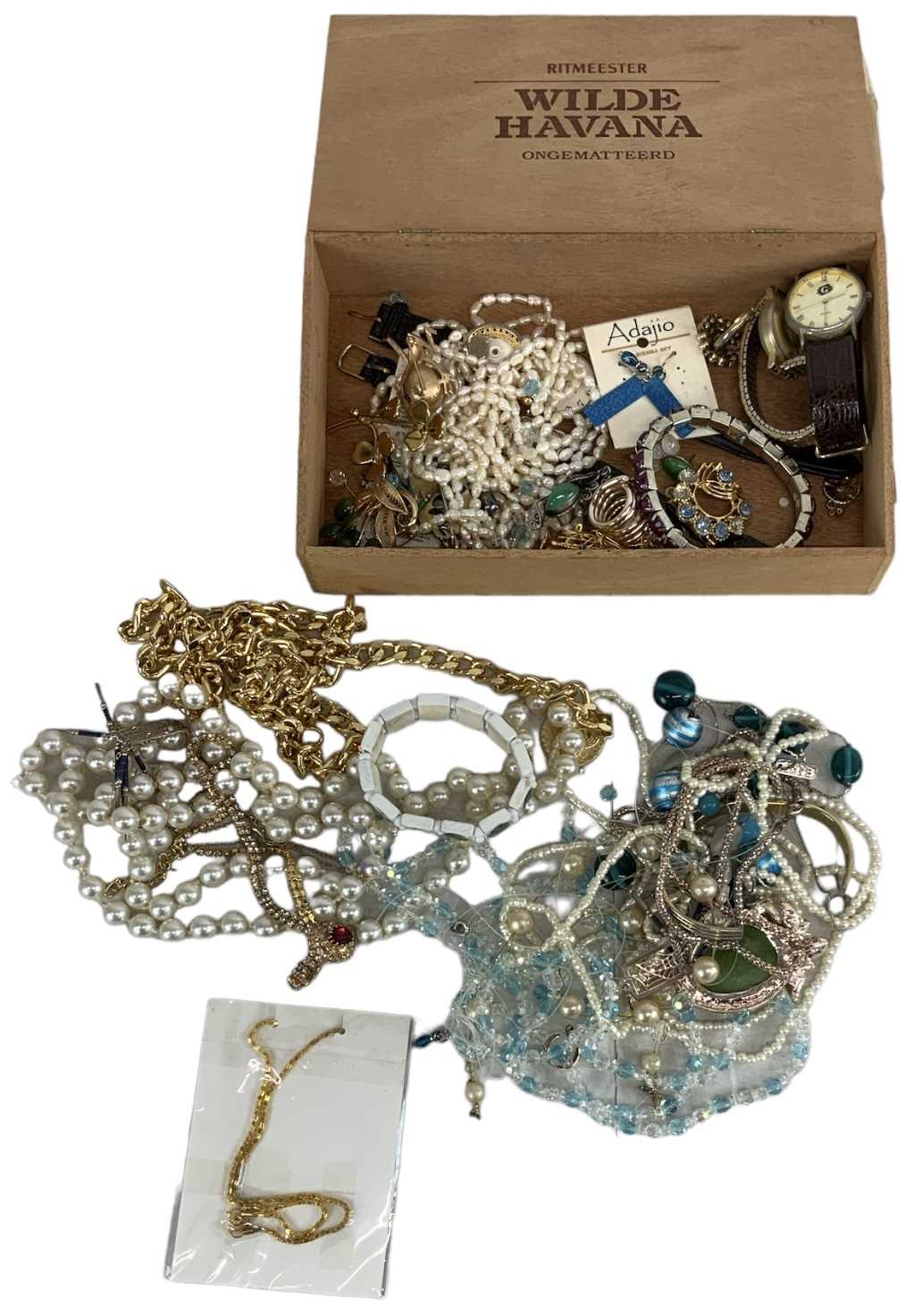 A quantity of costume jewellery and watches.