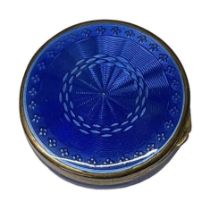 A 925 grade hallmarked silver blue enamelled compact, diameter 3.5cm.