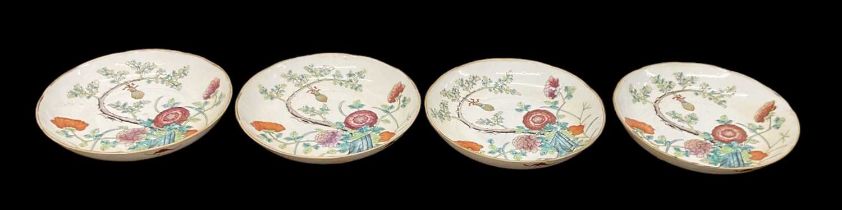 A set of four 20th century Chinese porcelain floral decorated plates, four character mark to base,