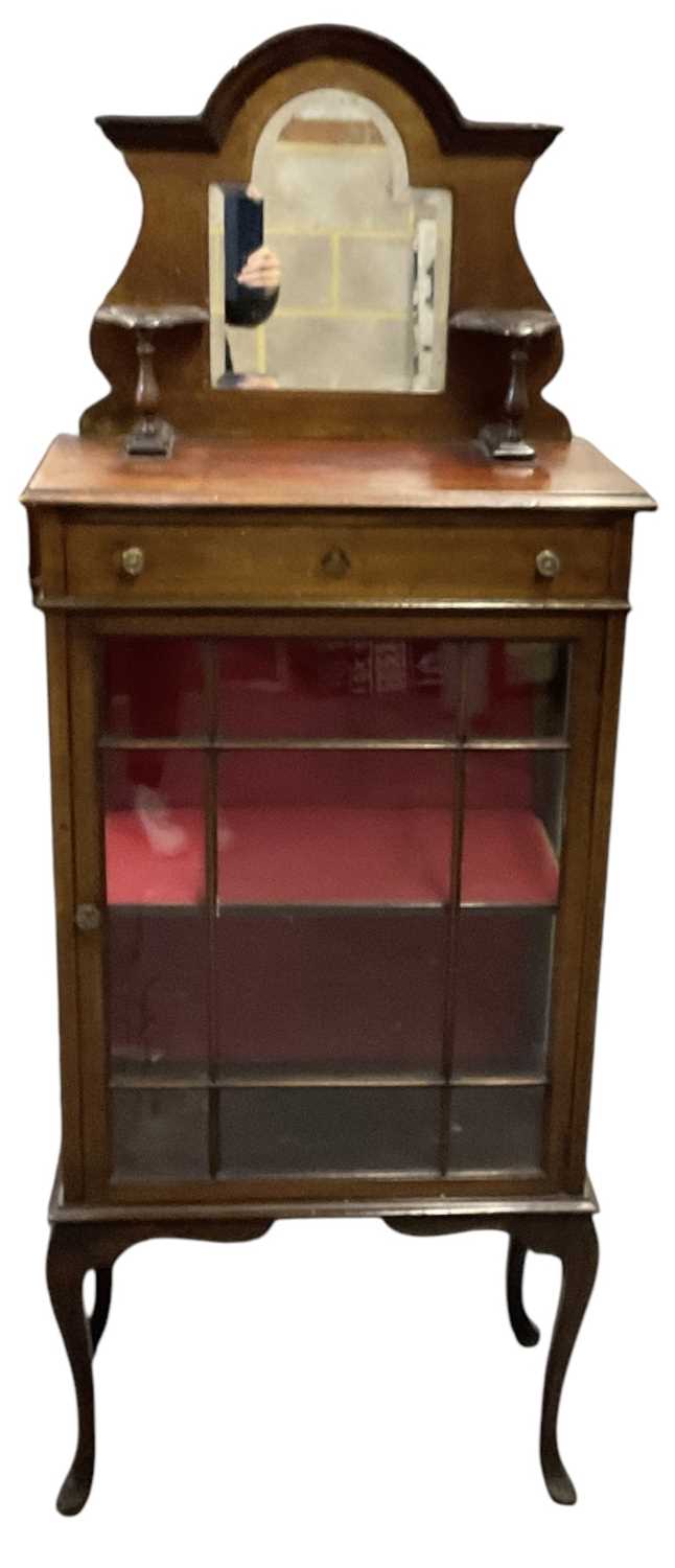An early 20th century mahogany display cabinet with mirrored back, height 162cm, width 61cm.