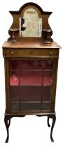 An early 20th century mahogany display cabinet with mirrored back, height 162cm, width 61cm.