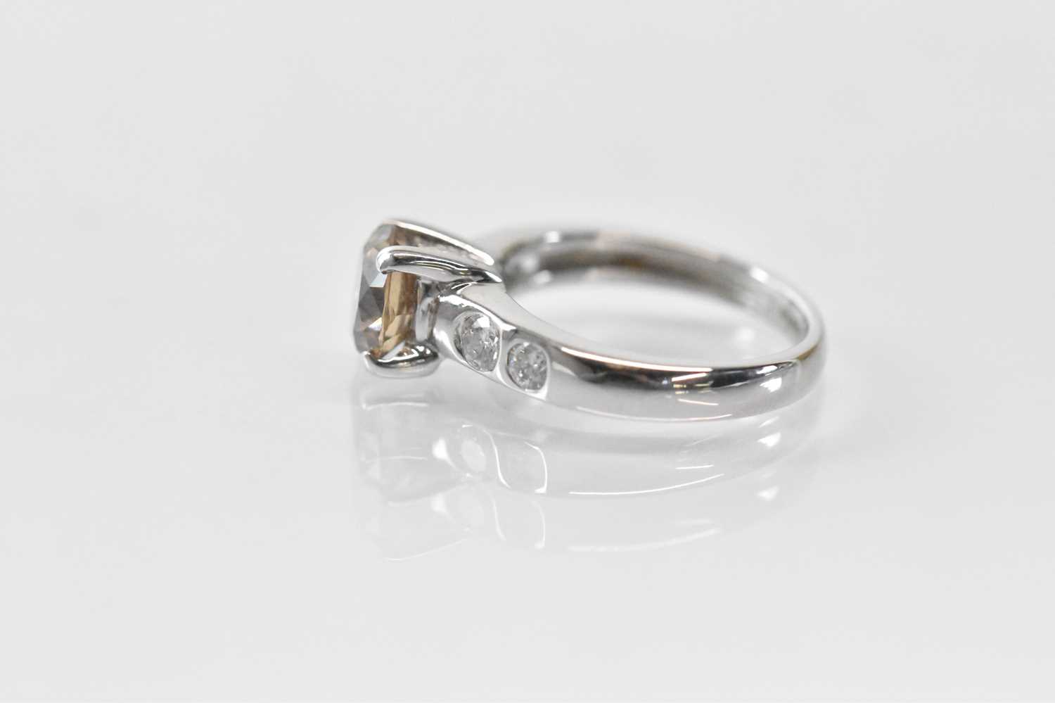 An 18ct white gold single stone diamond ring, the central round brilliant cut cognac coloured - Image 2 of 4