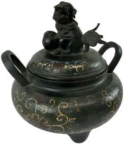 A 19th century Chinese bronze cloisonné enamel lidded twin handled censer, with a Dog of Fo to the