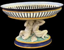 JULES VIEILLARD & CIE; a 19th century French majolica figural centrepiece, supported by two