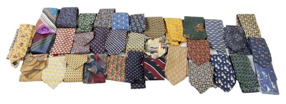 A group of approximately twenty-five silk ties including Pink, Harrods, Gucci, Jim Thompson, etc.