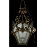 An ornate brass four sided glass insert lantern, height 46cm.