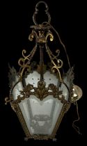 An ornate brass four sided glass insert lantern, height 46cm.