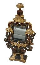 An elaborate gilt wood framed table top dressing mirror, with heart motif to the top and ancient