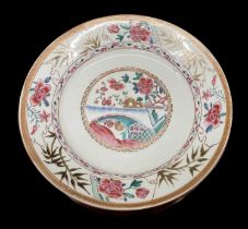 A Chinese Famille Rose porcelain plate decorated with foliage to the border and landscape to the