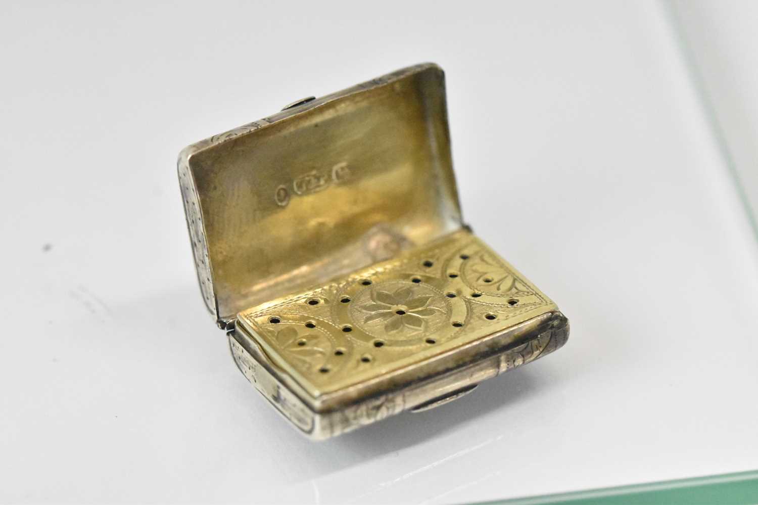 TAYLOR & PERRY; an early Victorian hallmarked silver satchel form vinaigrette with pierced gilt - Image 2 of 3
