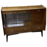 G PLAN; a mid century sideboard with two drawers above pair of sliding glass doors and two further