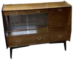 G PLAN; a mid century sideboard with two drawers above pair of sliding glass doors and two further