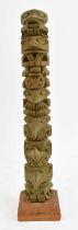 RAYMOND WILLIAMS; a carved wooden totem pole, signed to the base, height 31.5cm.