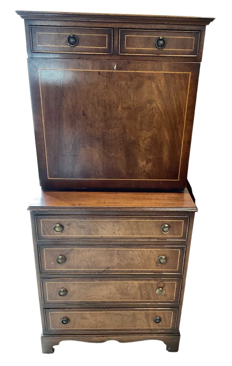 A reproduction mahogany and inlaid fall front bureau with two drawers above fall front over four