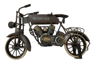 An early 20th century tin plate motorcycle, length 32cm, height 18cm.