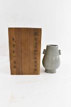 A Chinese celadon glazed Guan type vase, height 18cm, contained in wooden case.