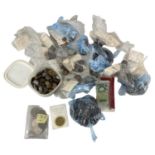 A quantity of all world coins and banknotes, including pound notes, pennies, sixpences, a silver