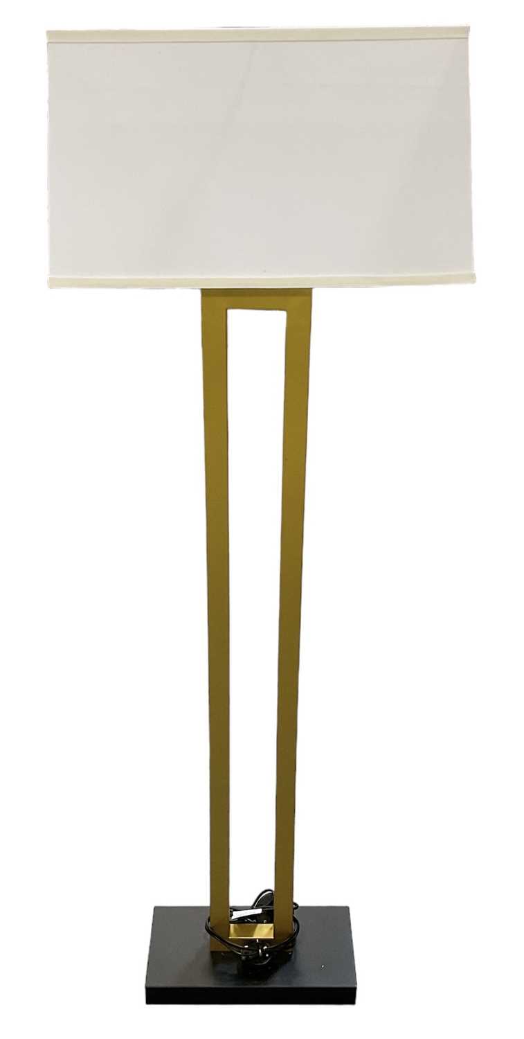 A modern contemporary gilt metal standard lamp on ebonised base, with white shade, height to top