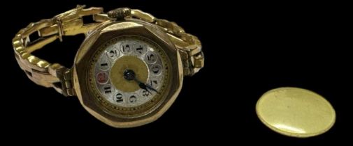 A 9ct yellow gold lady's wristwatch, diameter excluding winding crown 2.2cm (lacking glass), gross