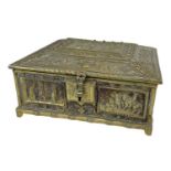 A late 19th century brass casket with figural decoration to the top, 18 x 16cm.