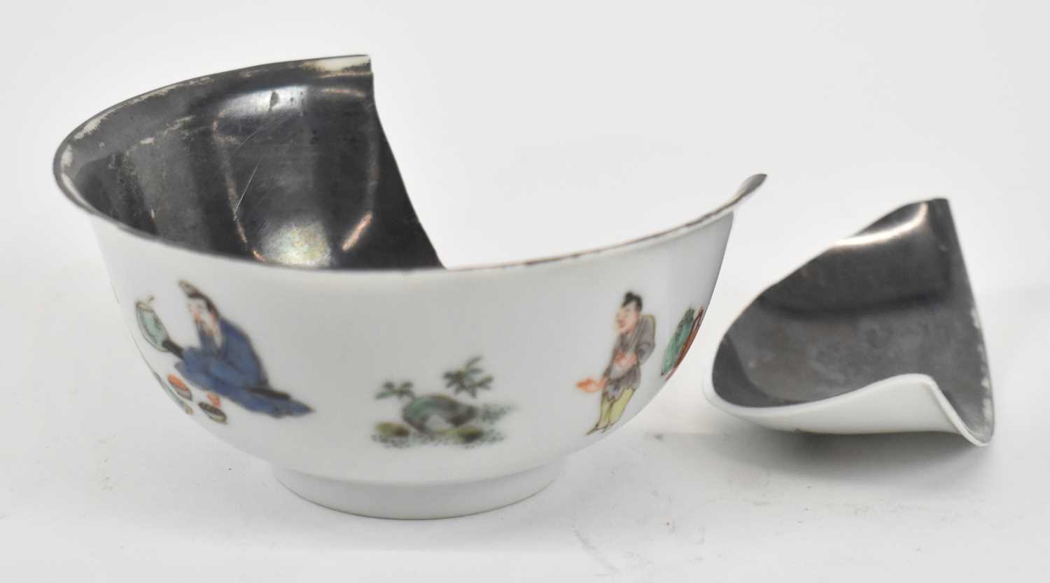 A Chinese Kangxi porcelain bowl with painted exterior and silvered interior, six character mark to