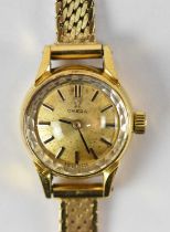 OMEGA; a lady's 14ct yellow gold wristwatch on 14ct yellow gold strap, length 18cm, gross weight