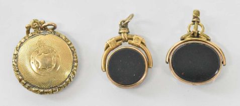 A 10ct yellow gold agate set fob, a 9ct yellow gold agate set fob and a yellow metal mourning