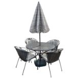 A modern wrought iron circular garden table, diameter 105cm, together with four chairs, umbrella and