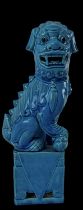 A 20th century Chinese blue glazed Dog of Fo, inscribed to base 'Bronze Lion at the Gate of