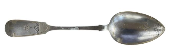 A Russian 84 grade silver tablespoon, with gilt wash bowl and elaborate decoration to the reverse,
