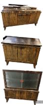 A 1930s Art Deco veneered sideboard, with single drawer above cupboard door, flanked by pair of