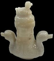 A Chinese jadeite twin handled lidded vase with carved figural duck decoration to either side and