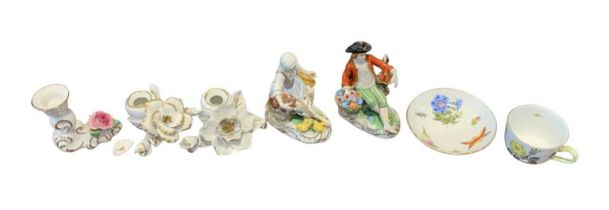DRESDEN; a porcelain figure of a lady holding a chicken and a matching figure of a gentleman, also a